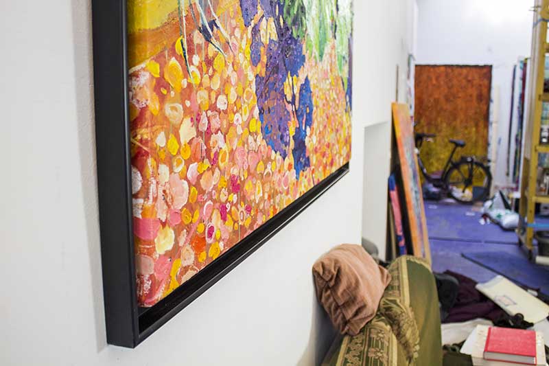 
the framed painting a quiet corner in the studio
